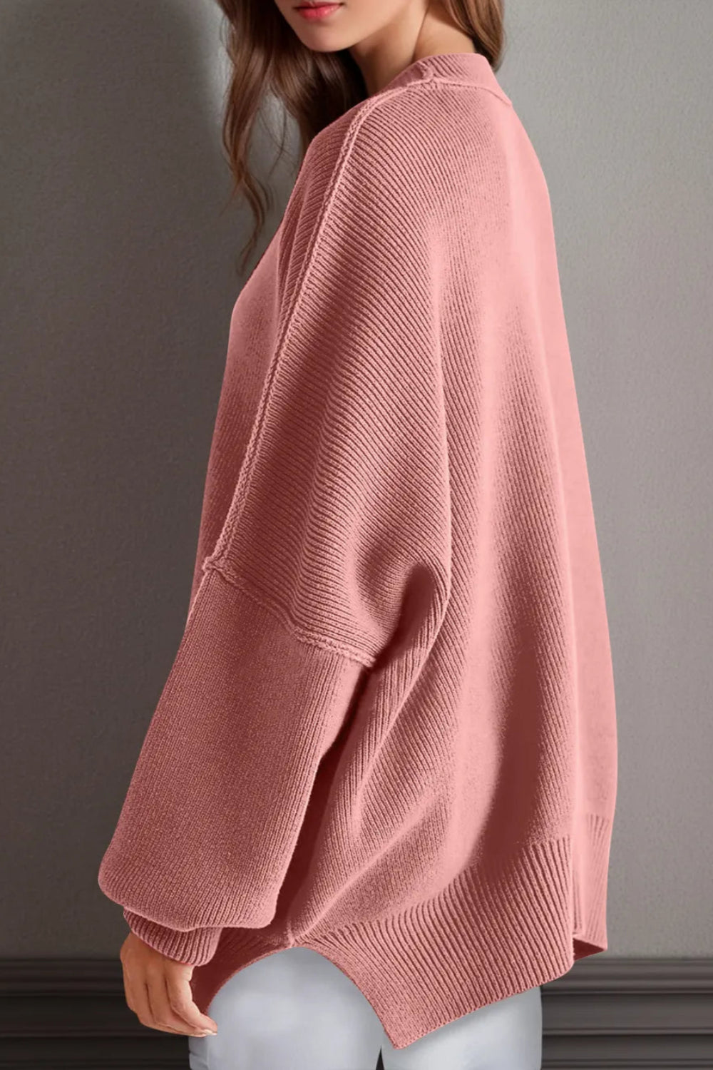 Sweater, oversized, drop shoulder, round neck, exposed seam, long, side slit, ribbed, stretchy side view
