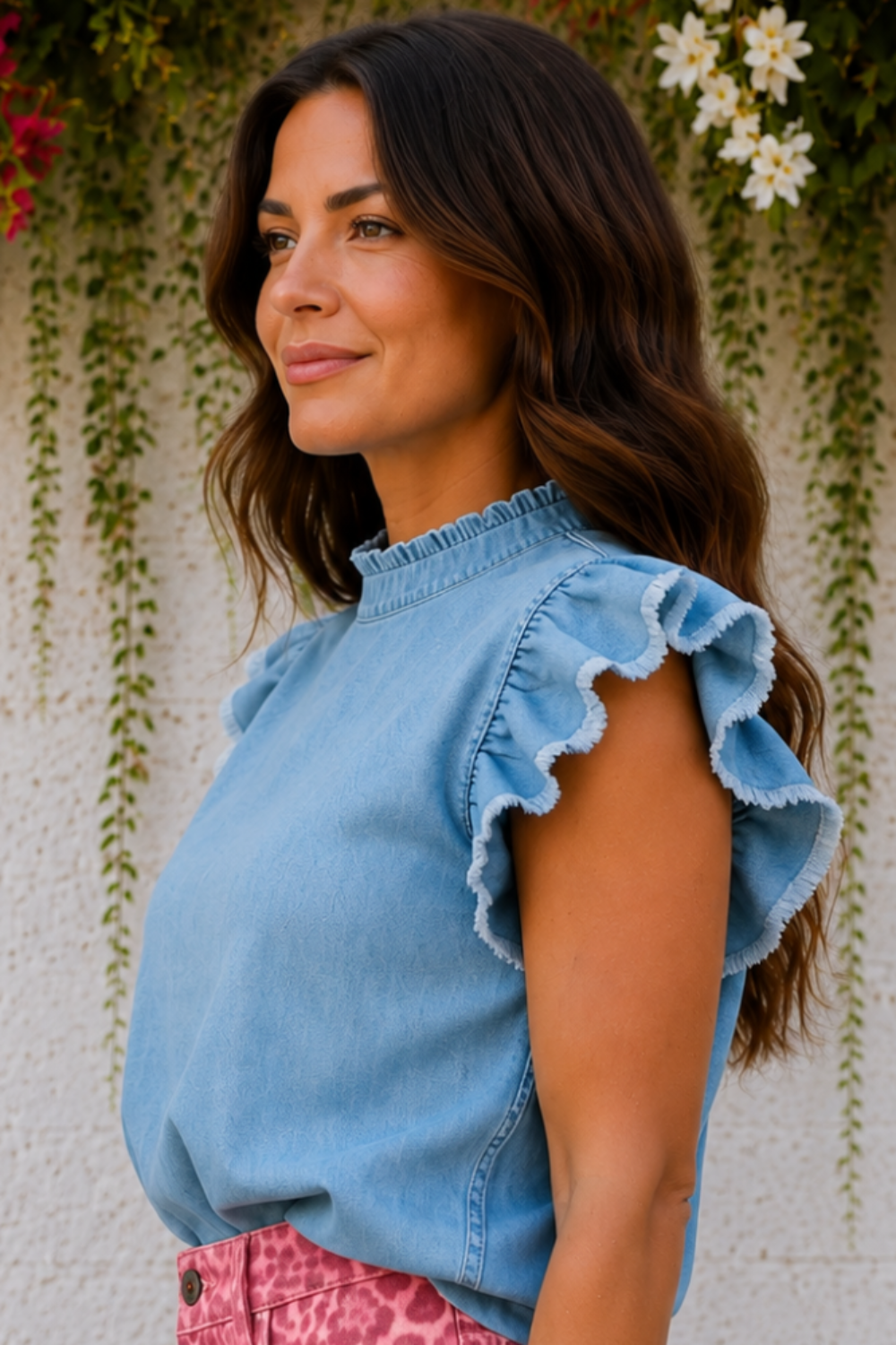 * Round ruffle neck
* Flutter distressed sleeve
* Denim
* Pearl style keyhole closure
* Pleated
* No stretch 
