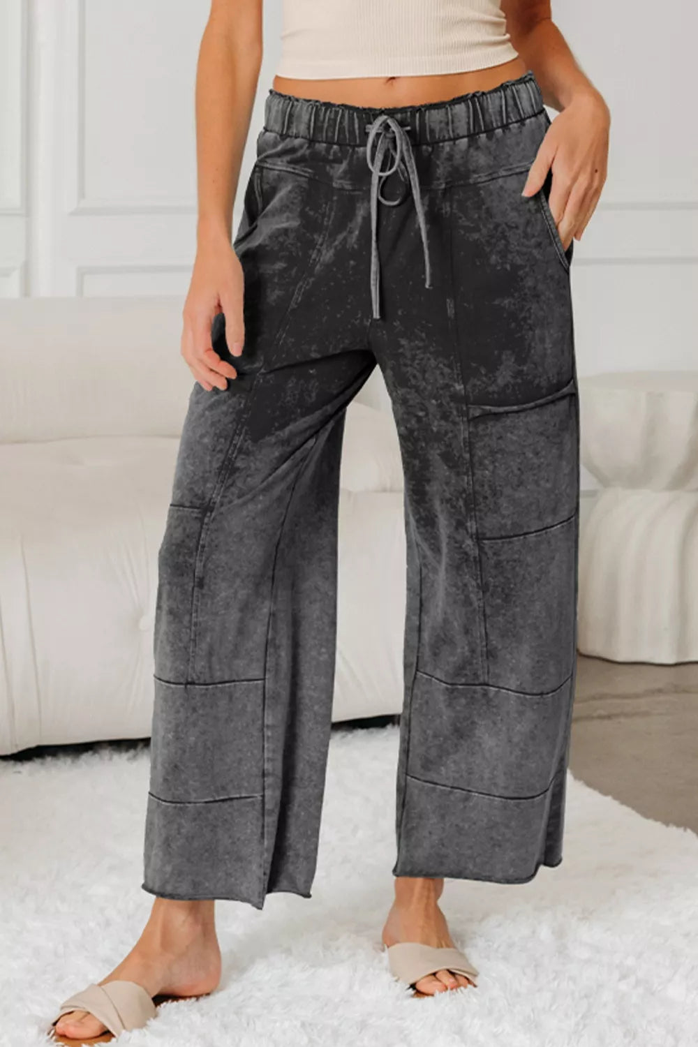 Pants, mineral wash, drawstring, elastic waist, raw hem, pocketed, high waist, wide leg, some stretch, front view
