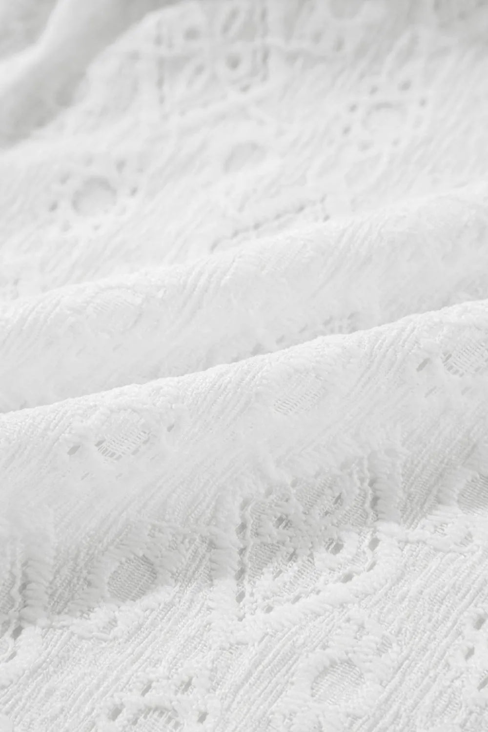 Mini dress, sleeveless, tied waist, tied keyhole back, partially lined, opaque, lace,  no stretch close up view
