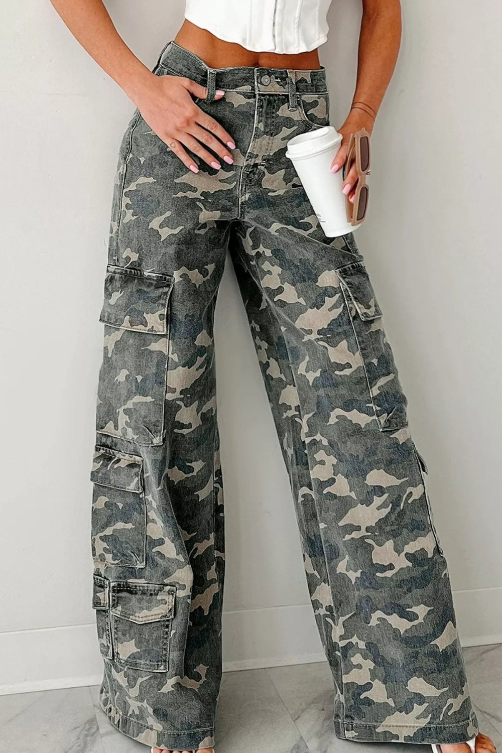 Jeans, cargo, camo print, belt loops, zipper/button closure, wide leg, some stretch, high waist, front view