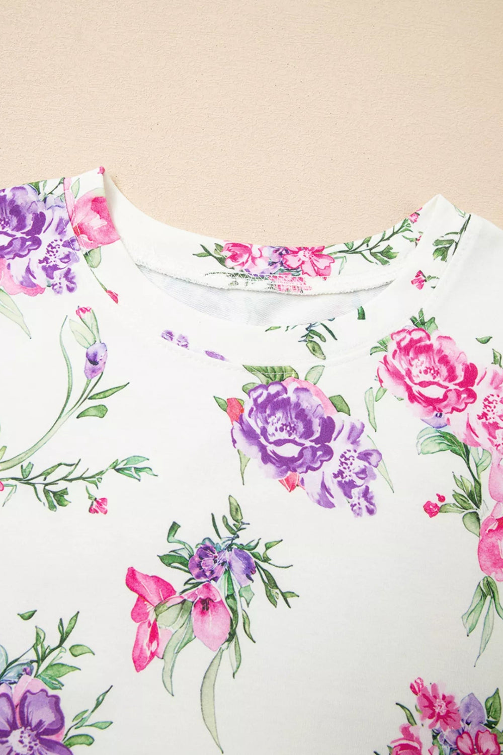 Two-piece loungewear set, floral print, round neck, long sleeves, drop shoulder, elastic waist, drawstring, pocketed, joggers, stretchy, close up view