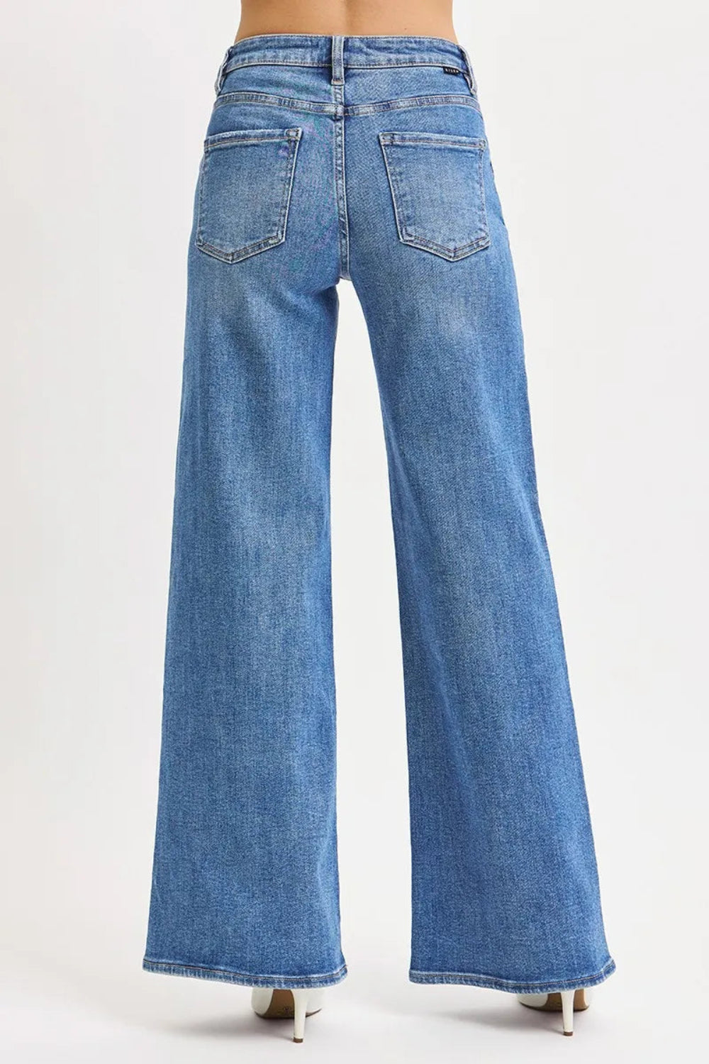 Risen jeans, full-size, high-rise, wide leg, vintage medium wash, 5-pocket detail, button-zipper closure, belt loop detail, slightly stretchy, distressed, back view