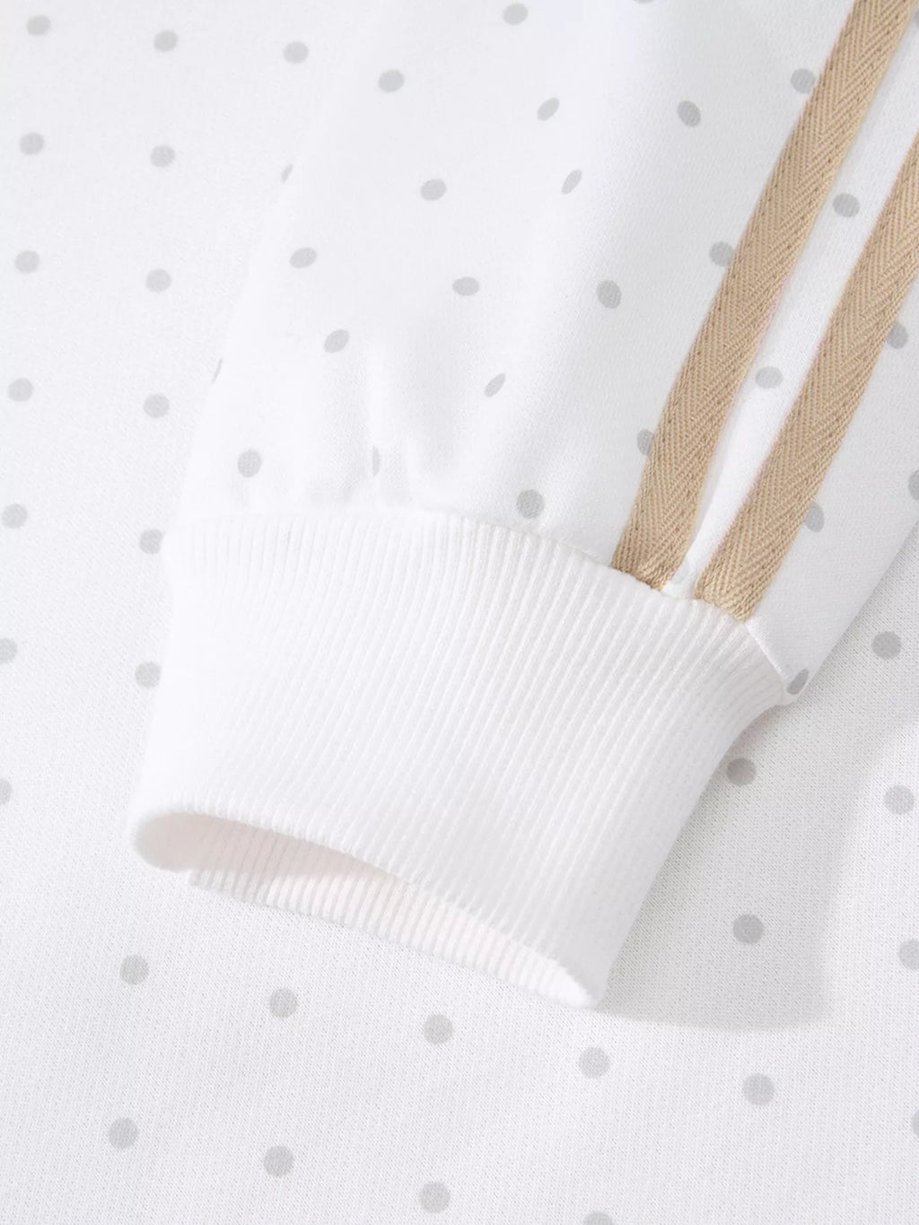 Cozy Dream Short Set in ivory with gray polka dots, a long-sleeve striped top, and matching ruffle-trim shorts close up view.