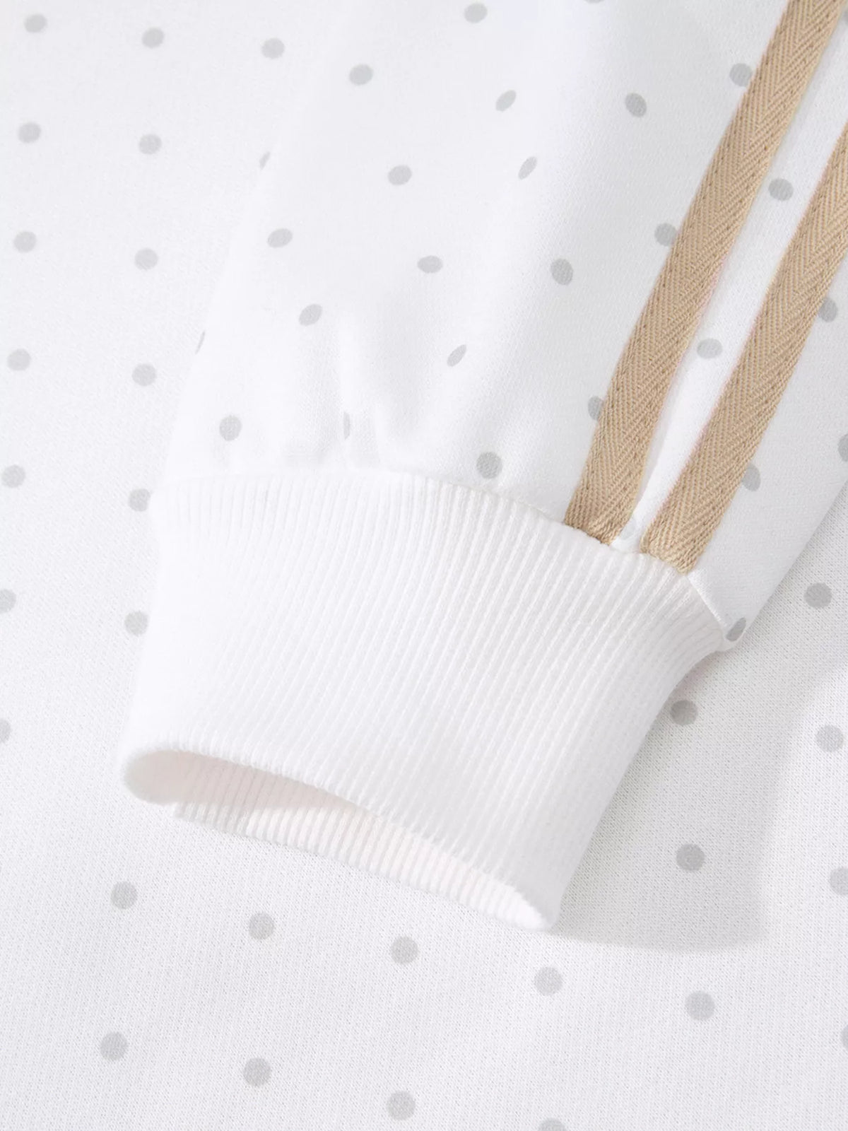 Cozy Dream Short Set in ivory with gray polka dots, a long-sleeve striped top, and matching ruffle-trim shorts close up view.