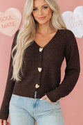 cardigan, chocolate color, long sleeve, v-neck, metal heart shaped button on front and cuffs, ribbed, medium length, slightly stretchy, front view