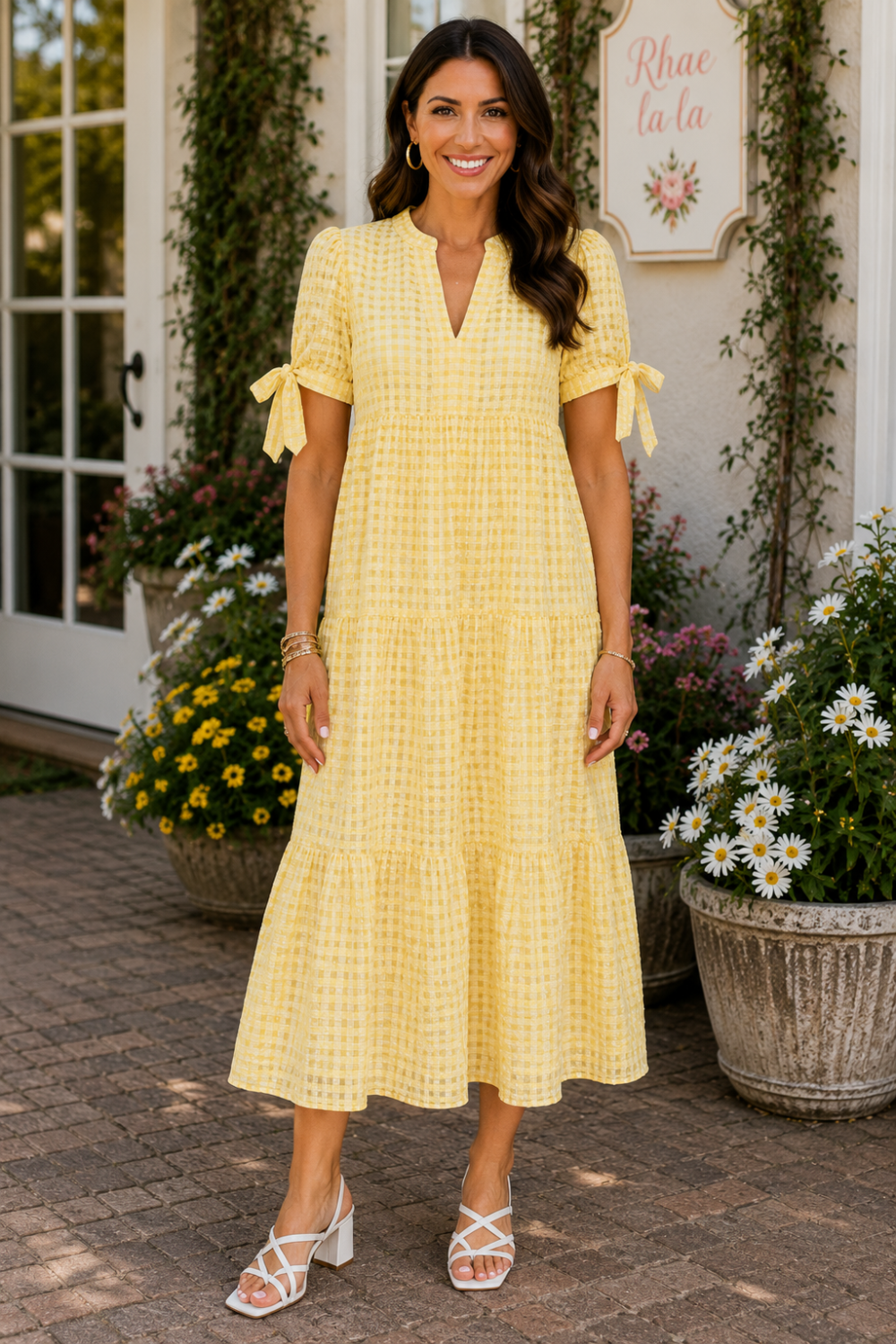 * Midi length
* Split v-neck
* Short sleeve
* Bow ties
* Tiered
* Gingham pattern
* Textured
* Unlined
* No stretch