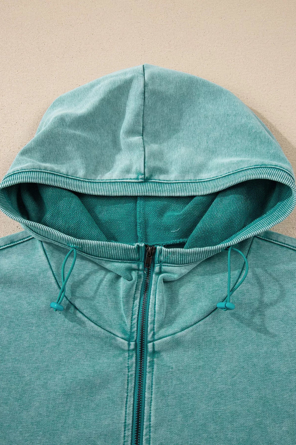 hoodie, half-zip, long sleeve, drop shoulder, kangaroo pocket, corded drawstring, ribbed, medium length, no stretch, close up view