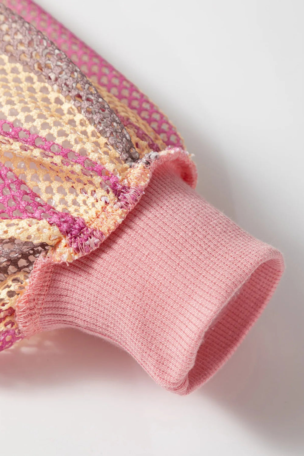 Top, mesh, patchwork, exposed seam, long sleeve, pullover, round neck, ribbed hem, slightly stretchy, close up view