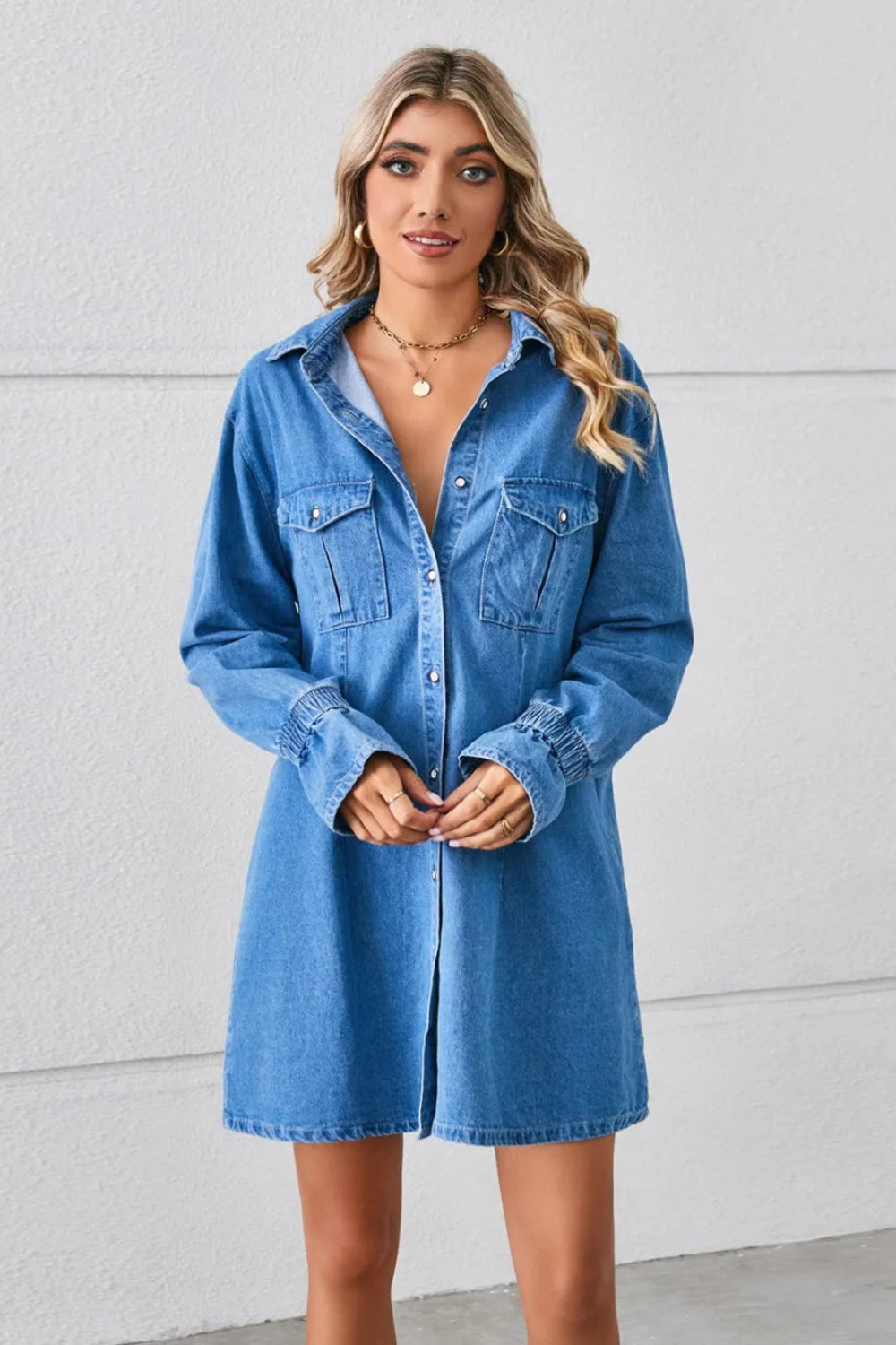 Shirt dress, mini, denim, drop shoulder, long sleeve, elastic ruffled cuffs, collared, front patch pockets, back pleat, no stretch, front view