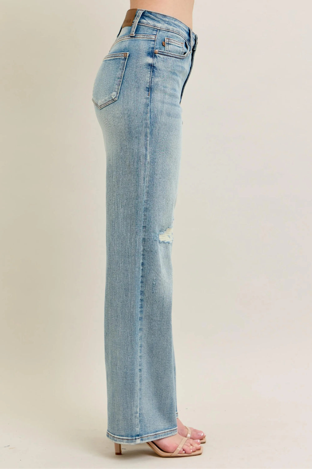 Judy Blue Jeans, full-size, high-rise, destroyed knee patch, distressed, pocketed, button and zipper closure, light wash, slightly stretchy, side view
