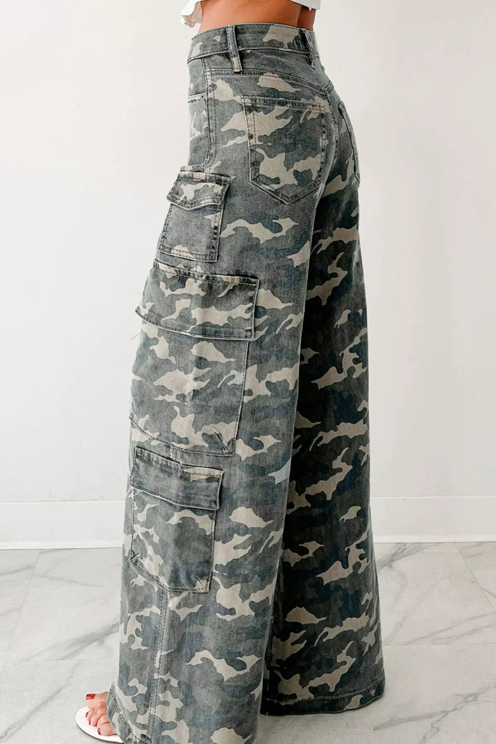 Jeans, cargo, camo print, belt loops, zipper/button closure, wide leg, some stretch, high waist, side view