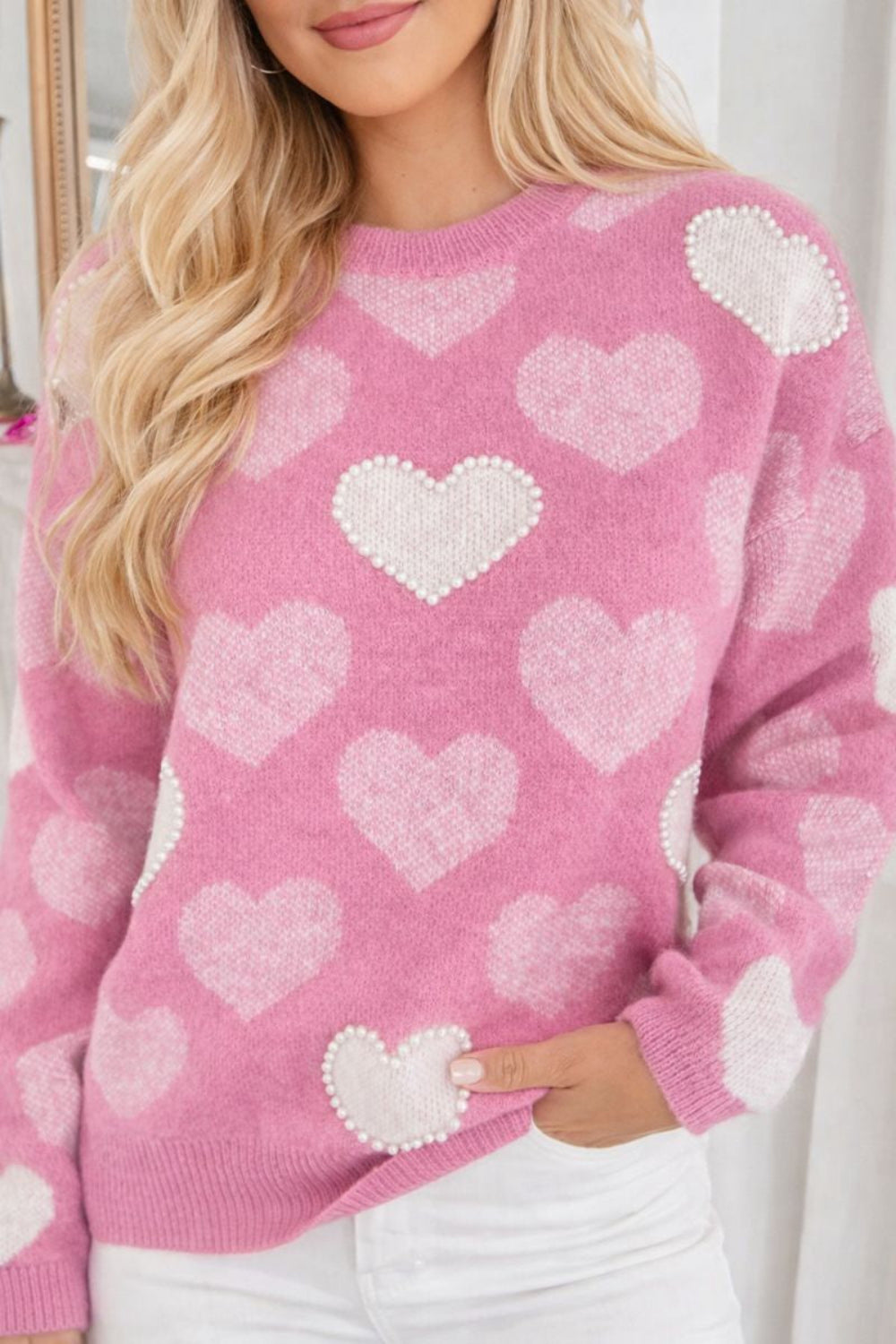 sweater, pullover, long sleeve, round neck, ribbed neck, cuffs and hem, heart print with pearl accents, drop shoulder, fuzzy texture, medium length, slightly stretchy, front view