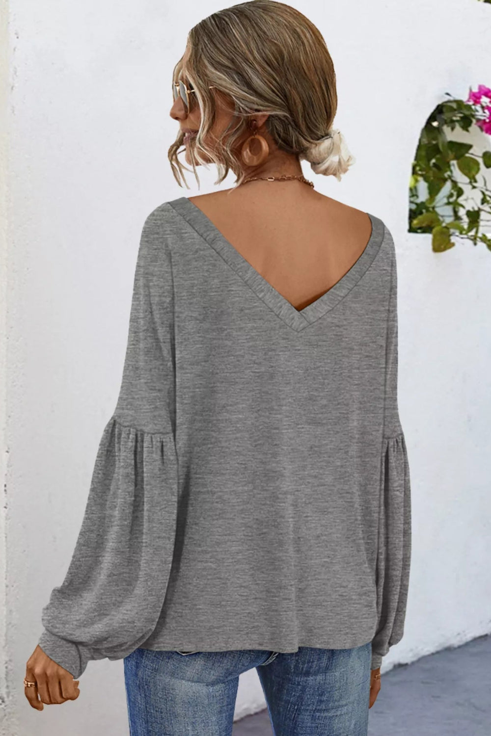 Blouse, Oversized, V-neck, Long sleeve, Drop shoulder, puff sleeve, front pocket, cuffed, v-back, sits below the waist, stretchy, back view