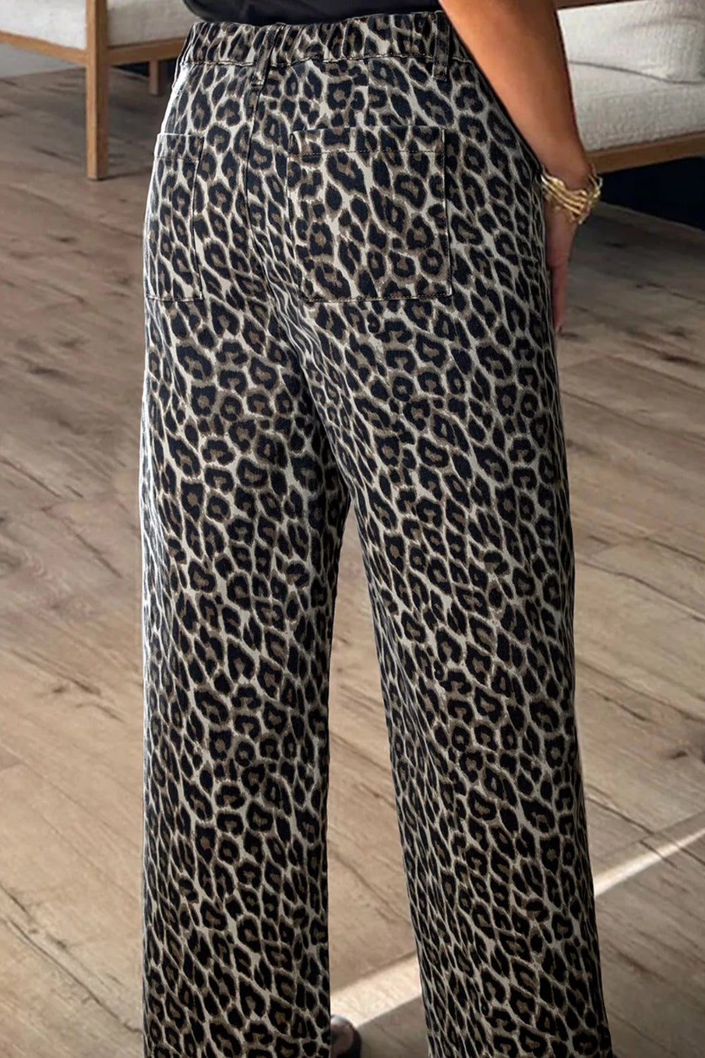 Jeans, leopard print, mid-rise, straight leg, elastic waist, belt loops, pocketed, button/zipper closure, frayed hem, some stretch, back view