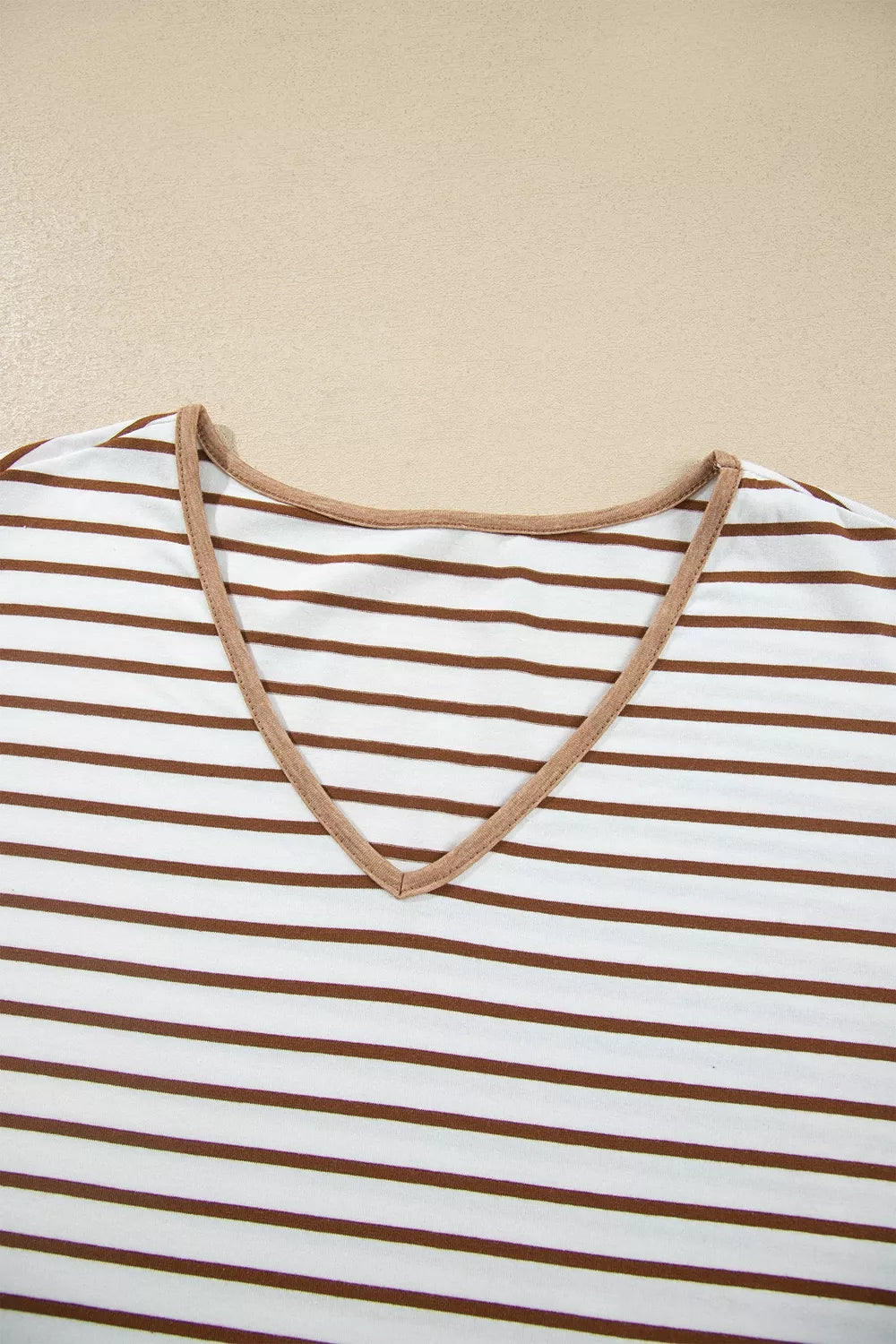 * Two-piece pant set
* Striped
* V-neck
* Long sleeve
* Drop shoulder
* Ruffled cuffs
* Side slit
* Elastic waist
* Drawstring
* Pocketed
* Ruffled
* Contrast trim
* Moderate stretch