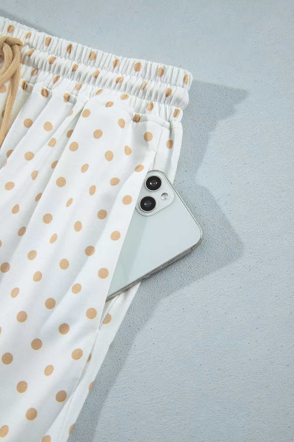 * Two-piece pant set
* Polka dot patchwork
* Round neck
* Long sleeve
* Drop shoulder
* Ribbed
* Oversized top
* Sits at waist
* High-waist
* Elastic waist
* Drawstring
* Pocketed
* Wide leg
* Slightly stretchy