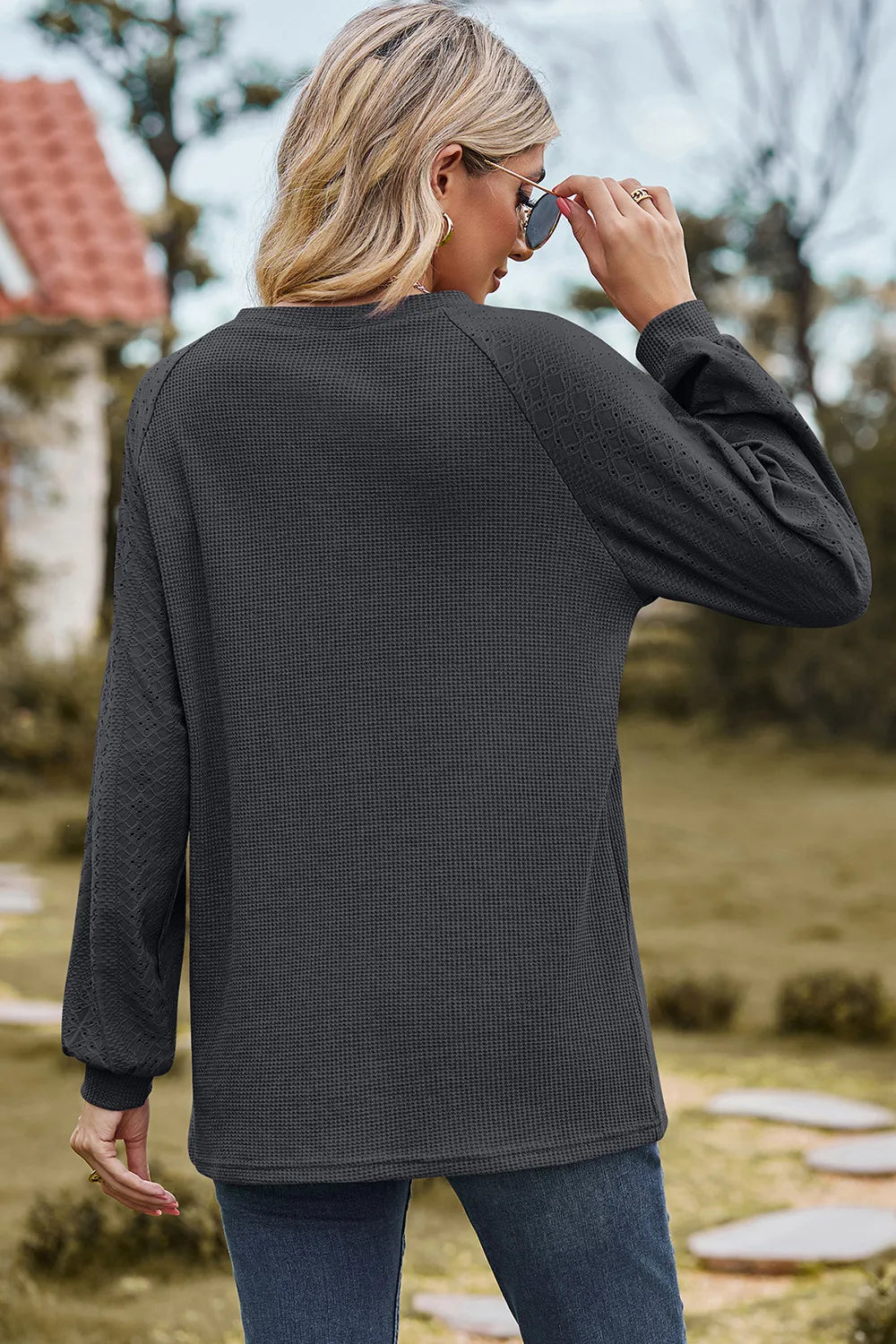 Top, raglan style, round neck, long sleeve, eyelet sleeves, ribbed, opaque, slightly stretchy, back view
