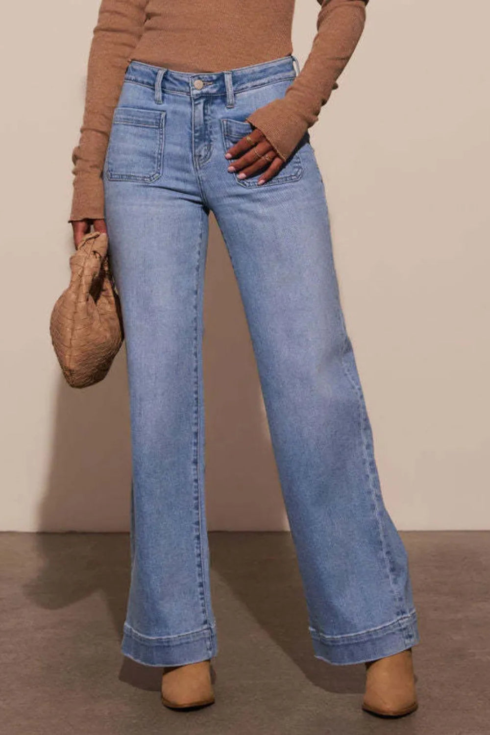 Jeans, high-waist, vintage wash, wide leg, front patch pockets, raw hem, back pockets, wide cuff, vintage wash, button/zipper closure, belt loops, slightly stretchy, front view