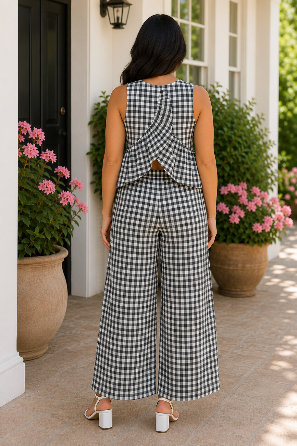 * Two-piece set
* Round neck
* Sleeveless
* Buttoned back closure
* Open back
* Elastic waist
* Pocketed
* Wide leg
* Ruffled
* No stretch
