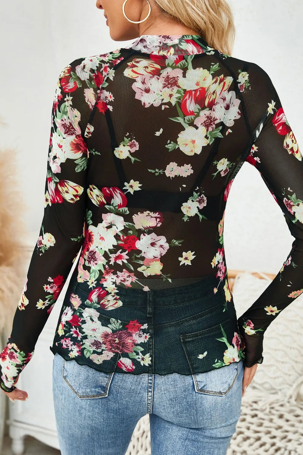 top, mesh, floral print, mock neck, long sleeve, thumb hole, stretchy, back view
