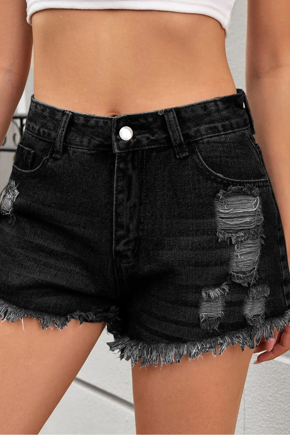 Distressed, Raw hem, High waist, Zipper and button closure, Functioning pockets,  No stretch, Denim shorts front view