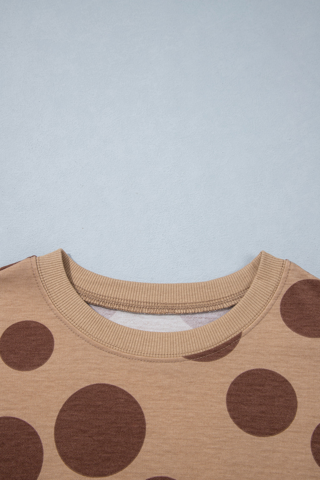 Point Taken Pant Set In Brown with an brown-and-tan polka-dot sweatshirt and matching wide-leg drawstring pants close up view.