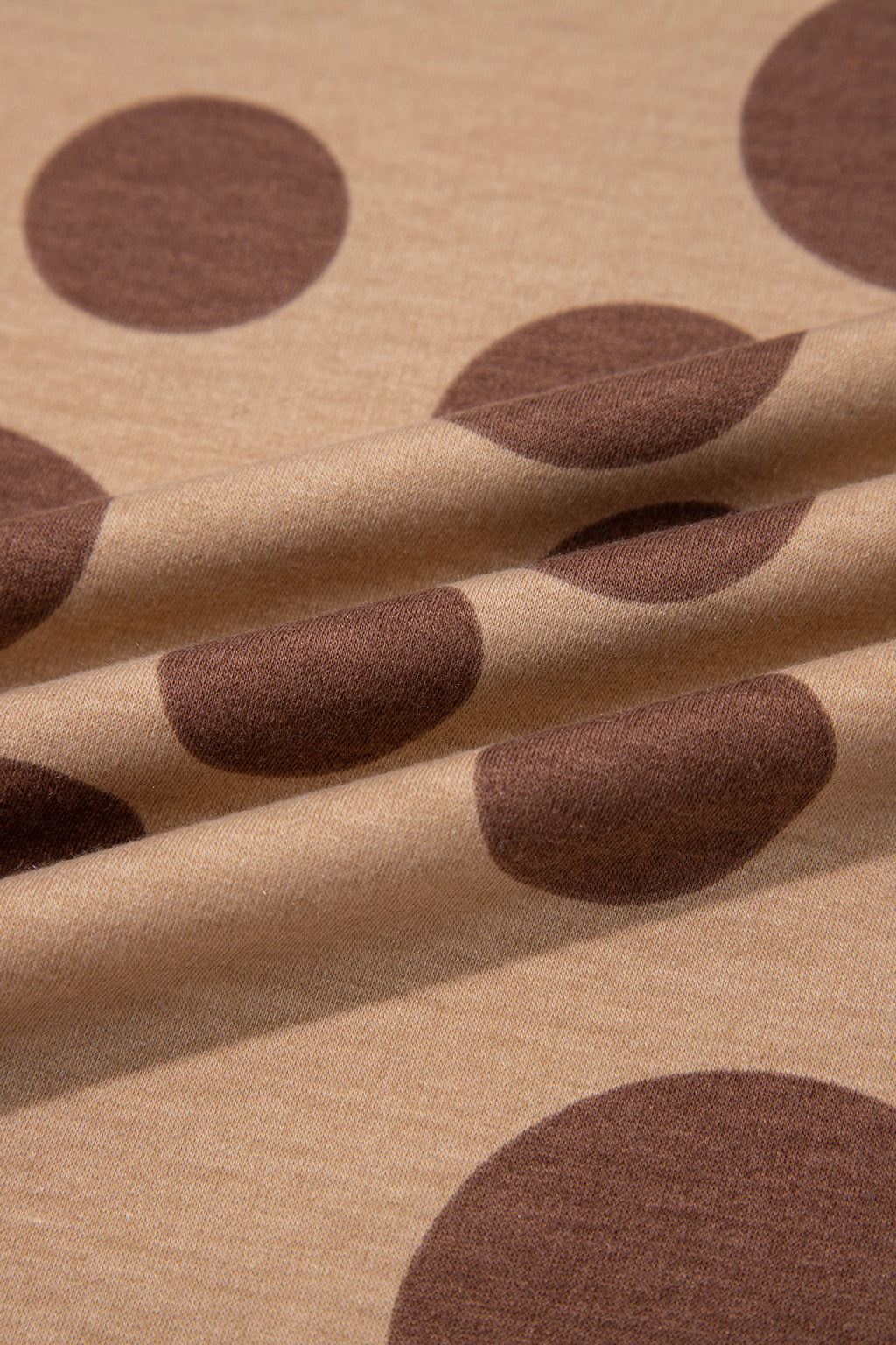 Point Taken Pant Set In Brown with an brown-and-tan polka-dot sweatshirt and matching wide-leg drawstring pants close up view.