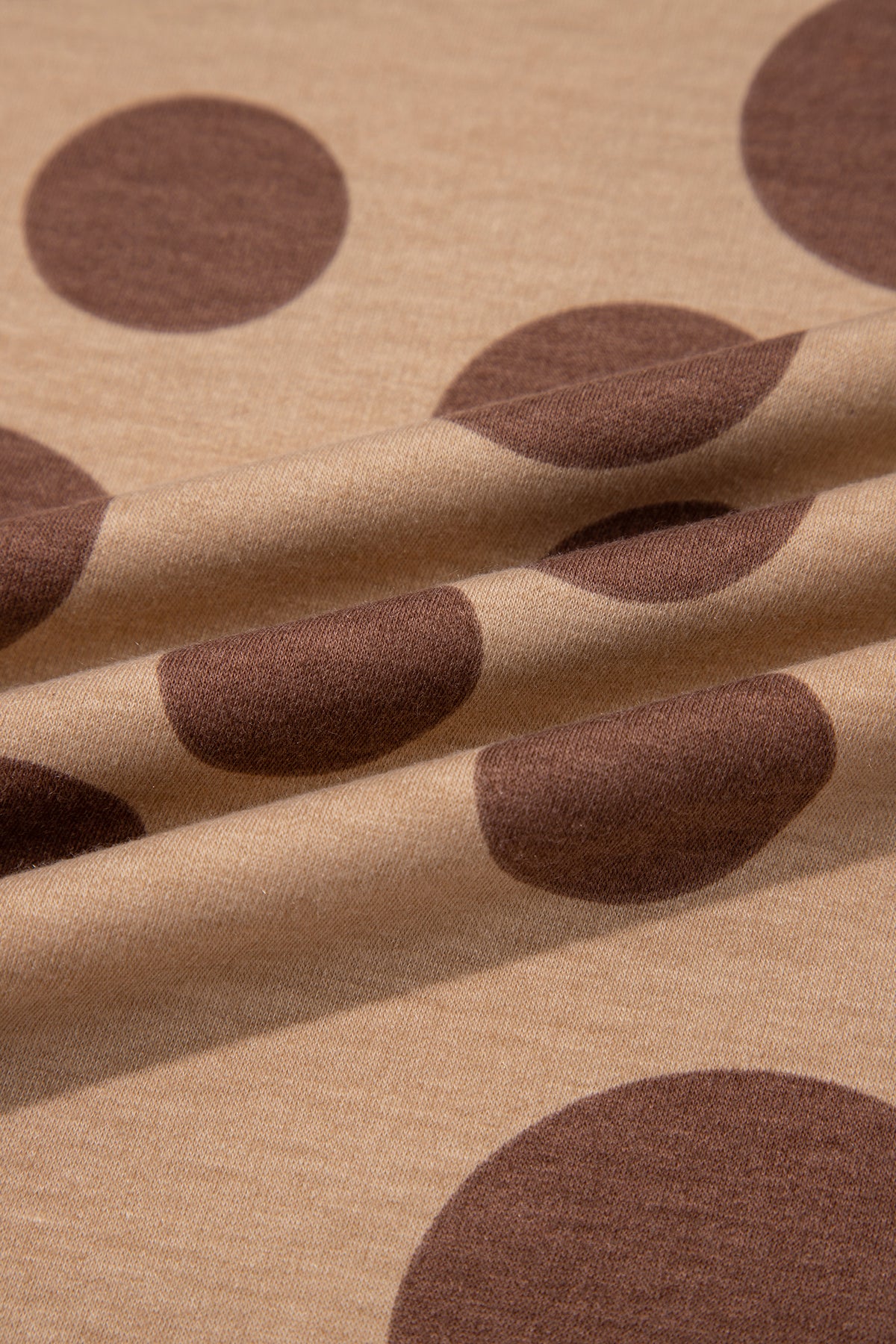 Point Taken Pant Set In Brown with an brown-and-tan polka-dot sweatshirt and matching wide-leg drawstring pants close up view.
