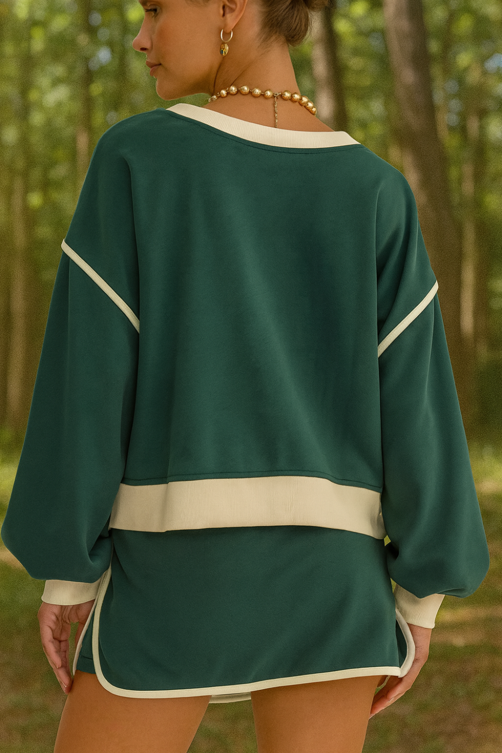 wo-piece skort set, round neck, pullover, drop shoulder, long sleeve, elastic waist, drawstring, pockets, contrast trim, slightly stretchy, back view
