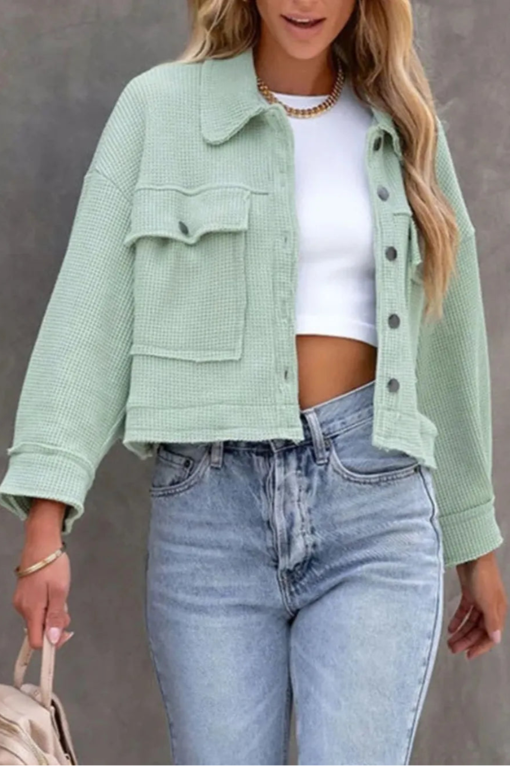 Jacket, collared, oversized, distressed, pleated, drop shoulder, buttoned, pocketed, long sleeve, waffle-knit, exposed seam, sits at the waist, pleated, adjustable straps, some stretch front view