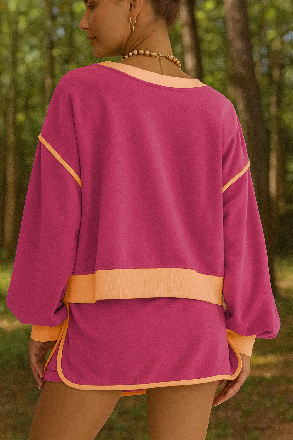 Two-piece skort set, round neck, pullover, drop shoulder, long sleeve, elastic waist, drawstring, pockets, contrast trim, slightly stretchy, back view