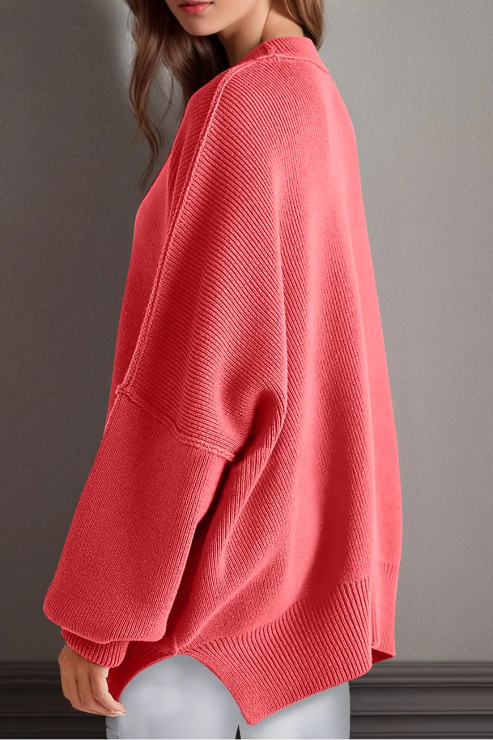Sweater, oversized, drop shoulder, round neck, exposed seam, long, side slit, ribbed, stretchy side view
