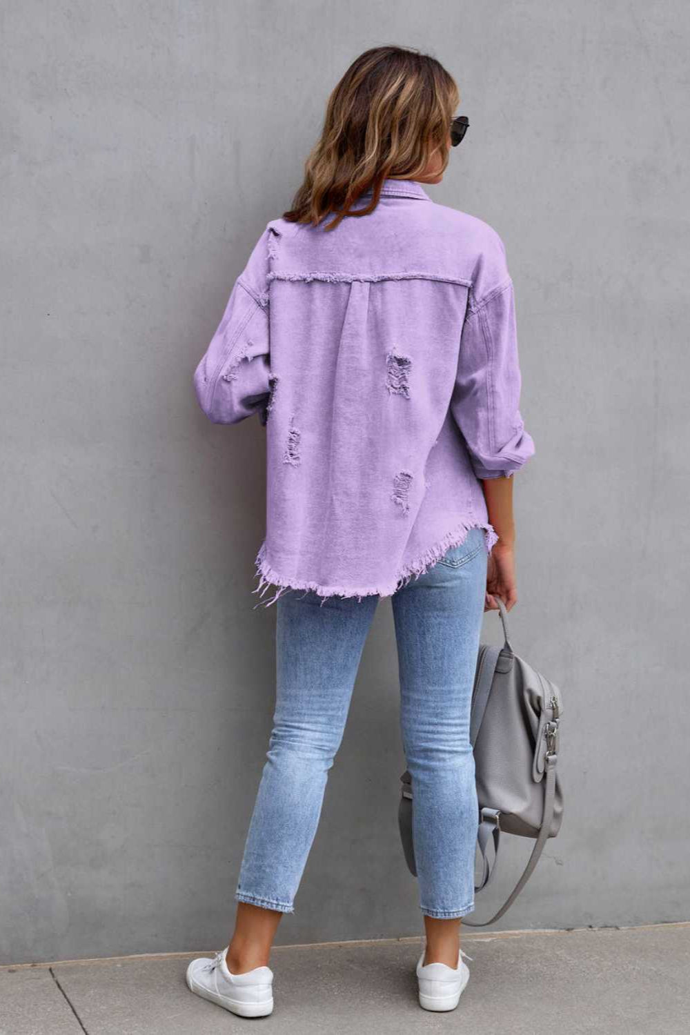 denim jacket, long sleeve, collared, buttoned, buttoned front patch pockets, distressed, fringed/raw hem, no stretch, multiple colors, back view