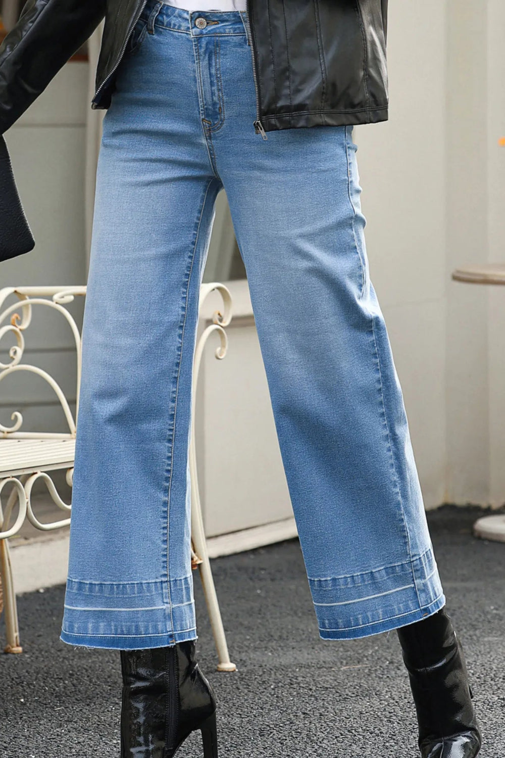 Jeans, high-rise, drop hem, raw hem, wide leg, pocketed, belt loops, button/zipper closure, vintage wash, some stretch, front view