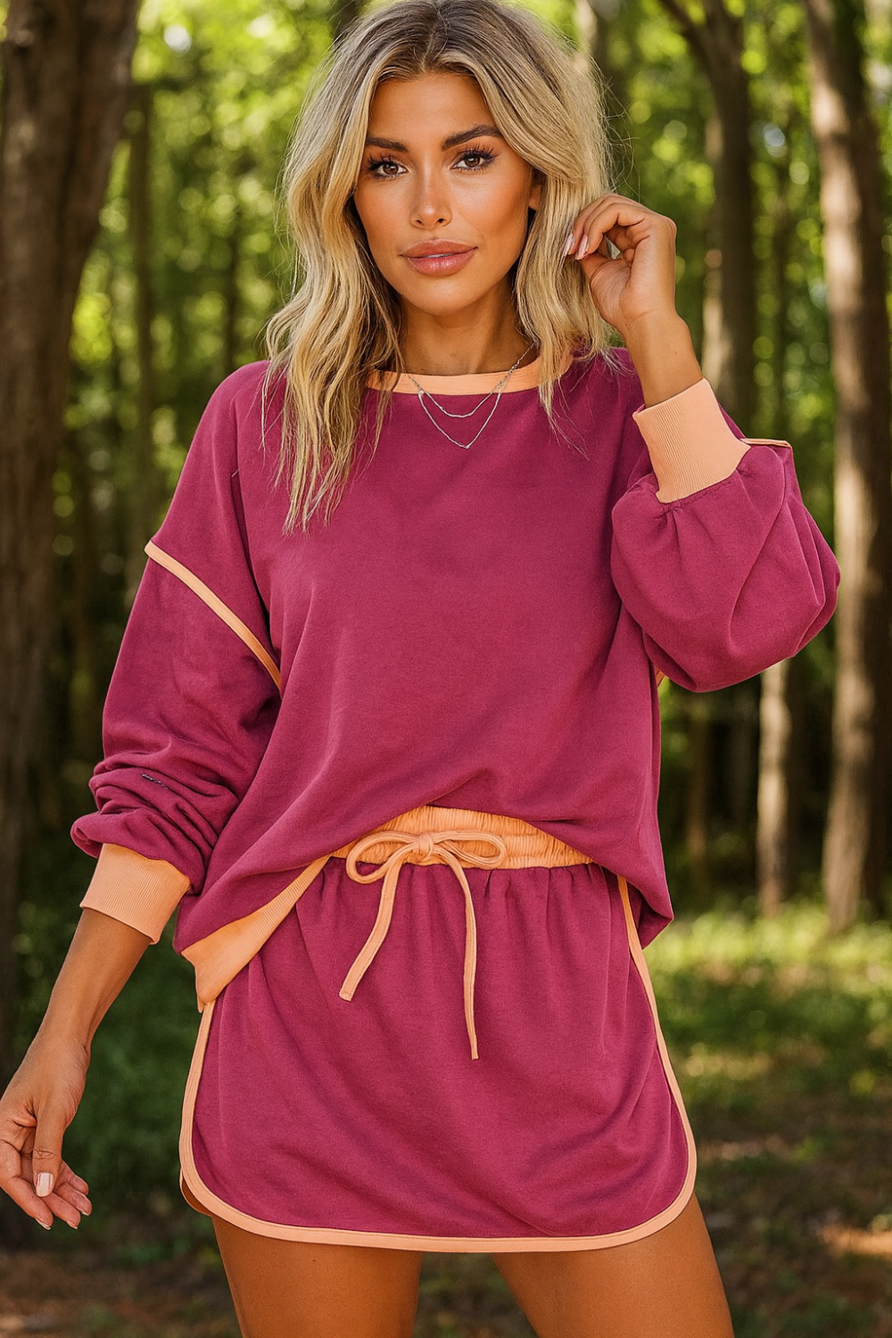 Two-piece skort set, round neck, pullover, drop shoulder, long sleeve, elastic waist, drawstring, pockets, contrast trim, slightly stretchy, from view