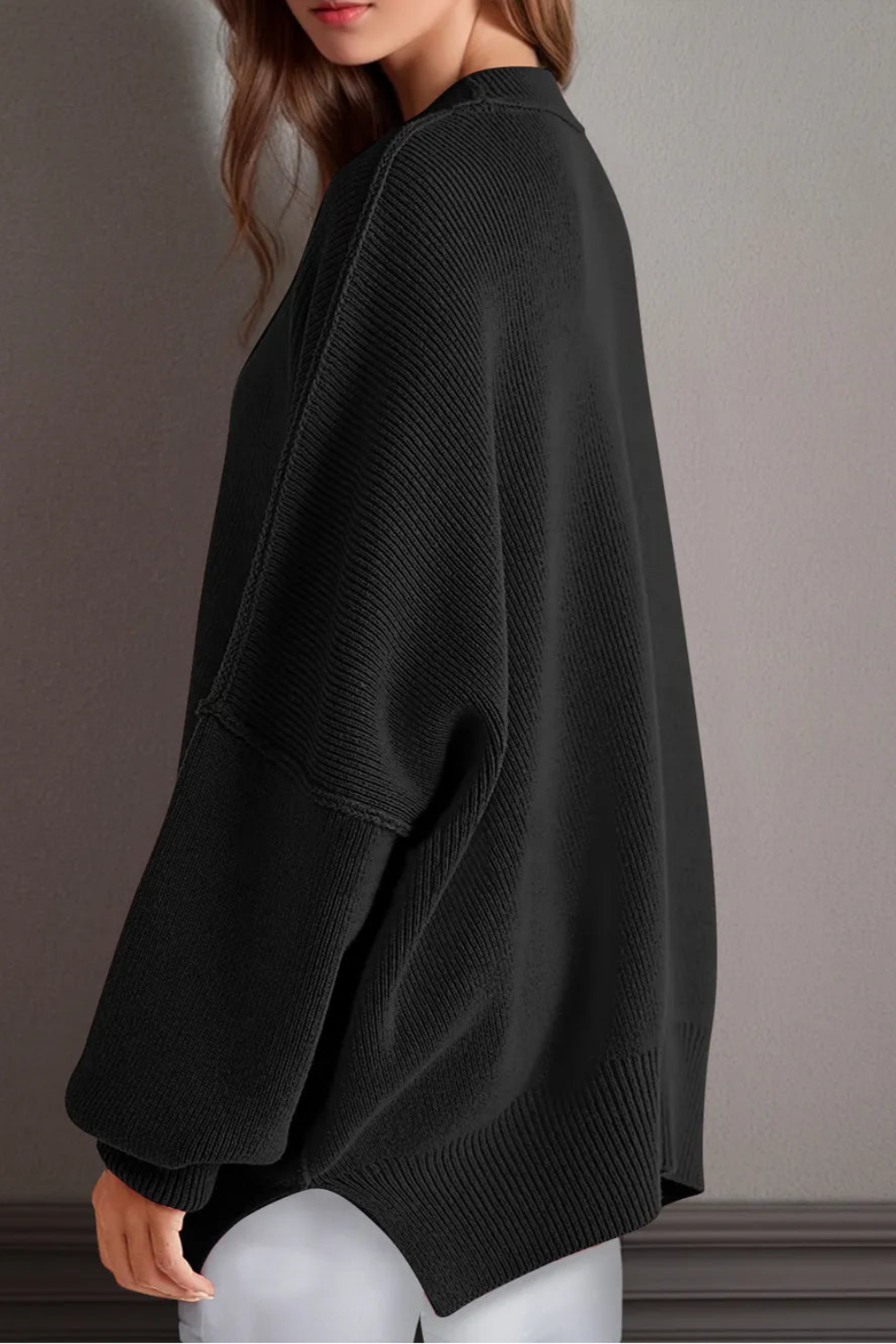Sweater, oversized, drop shoulder, round neck, exposed seam, long, side slit, ribbed, stretchy side view
