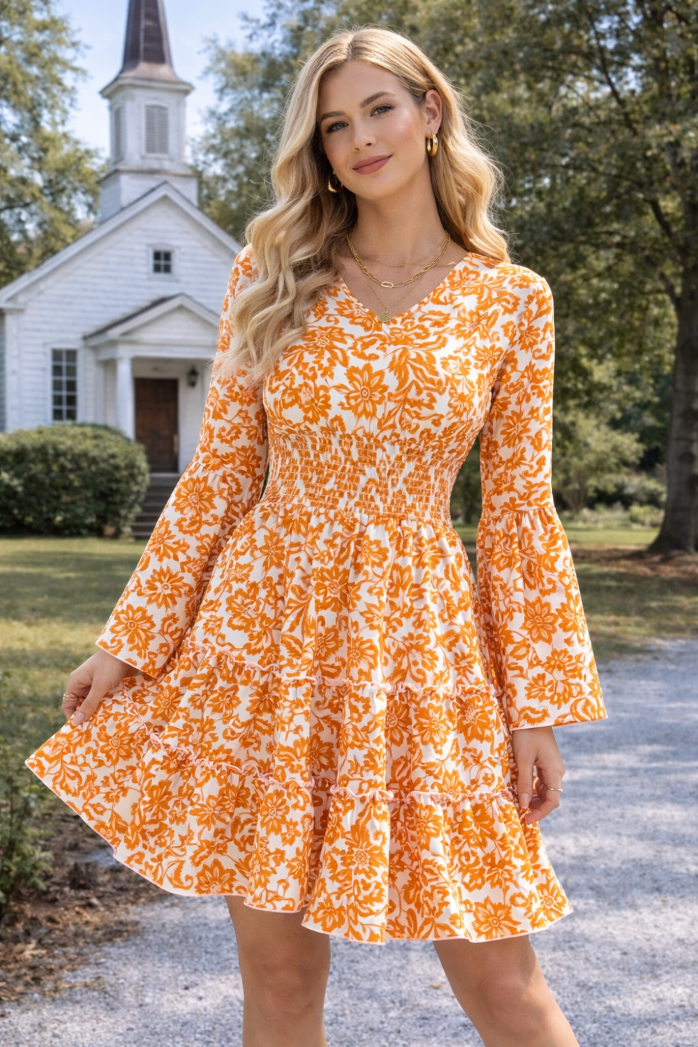 * Midi Dress
* Smocked
* Long flared sleeve
* V-neck
* Tiered
* Ruffle hem
* Unlined
* Slightly stretchy