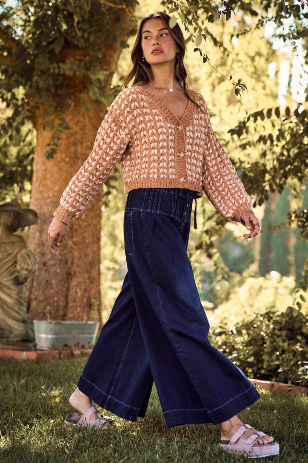 cardigan, long sleeve, v-neck, buttoned, cable knit, soft chenille yarn, sits at the waist, slightly stretchy, side view