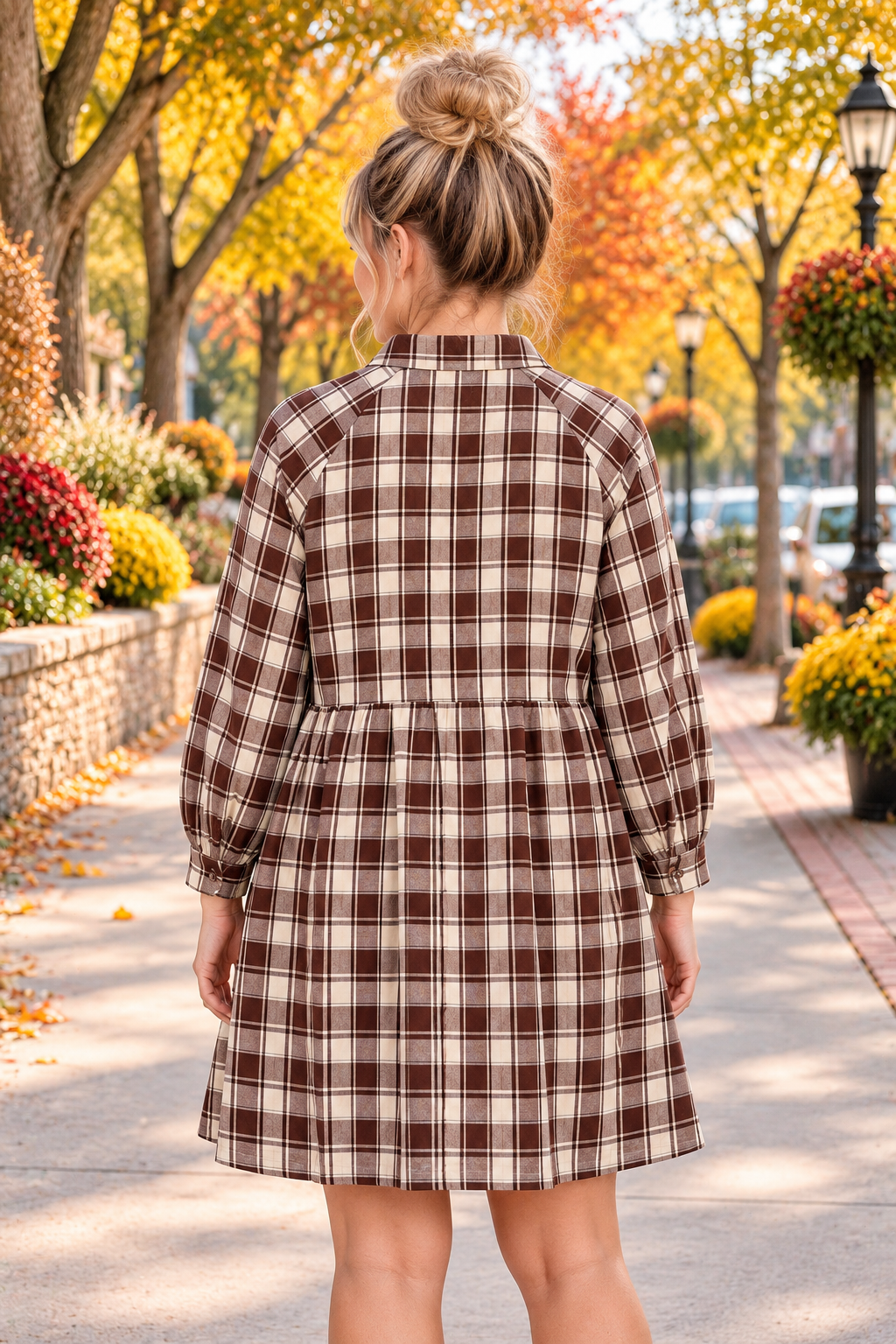 Back view of the Well Thought Of Mini Dress in brown and cream plaid with a collared button front, long sleeves, and pockets.