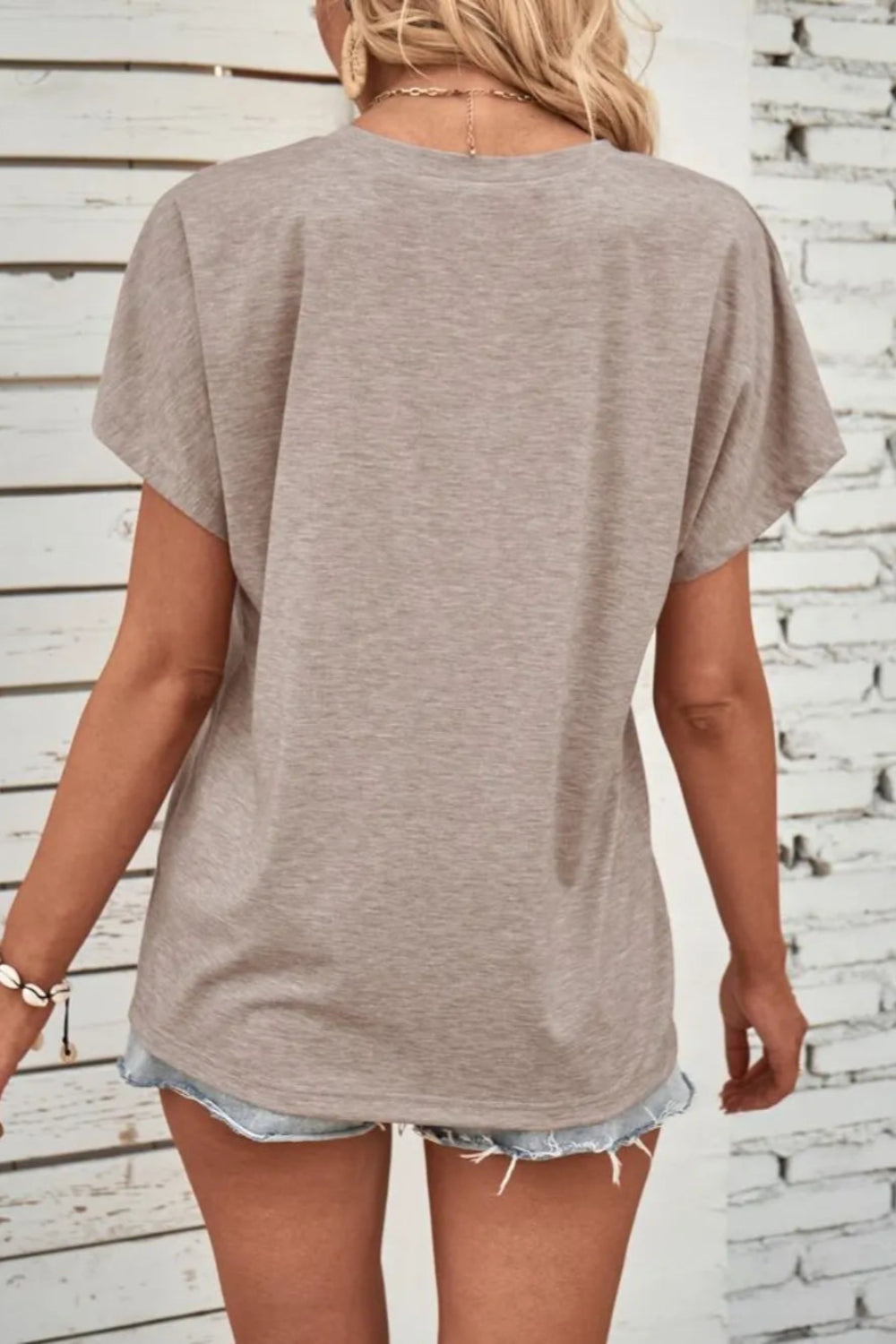Blouse, short sleeve, pullover, round neck, half buttoned, opaque, no stretch, back view