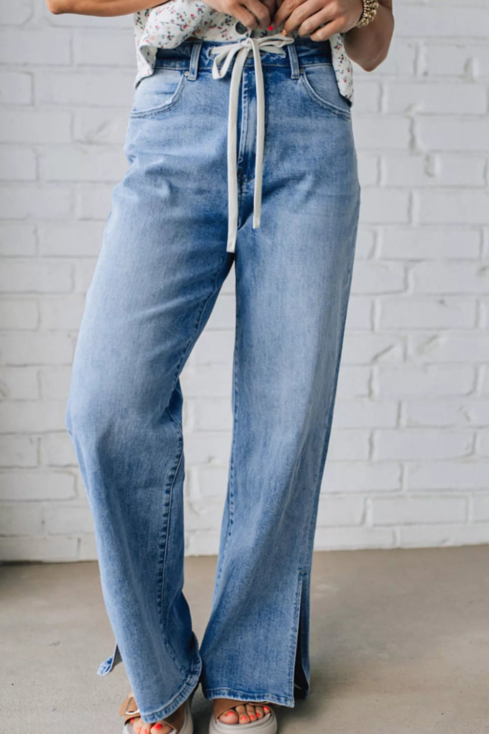 Jeans, slide slit, loose fit, wide leg, vintage wash, drawstring, button/zipper closure, pocketed, belt loops, some stretch, front view

