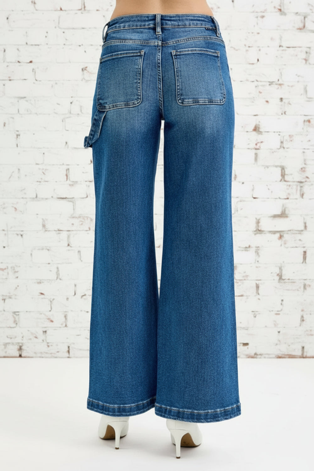 Risen Jeans, full-size, high-rise, darted, wide leg, one side hammer loop, pocketed, belt loops, button/zipper closure, washed, raw hem, slightly stretchy, front view

