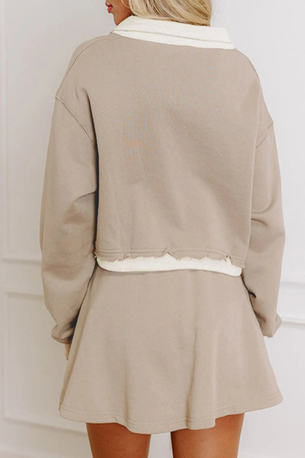Two-piece mini skirt set, long sleeve, v-neck, pullover, drop shoulder, collared, contrast trim, distressed, elastic waist, drawstring, pocketed, slightly stretchy back view