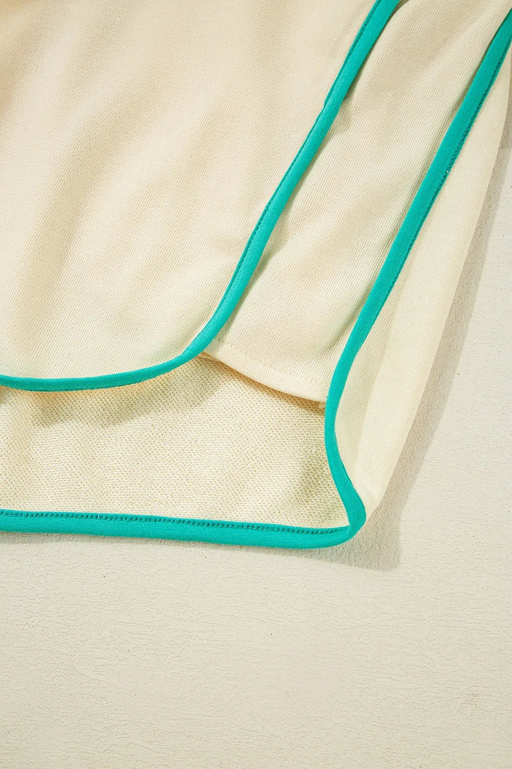 Two-piece short set, long sleeve, v-neck, contrast trim,  drawstring, pockets, elastic waist, scalloped hem, slightly stretchy close up view