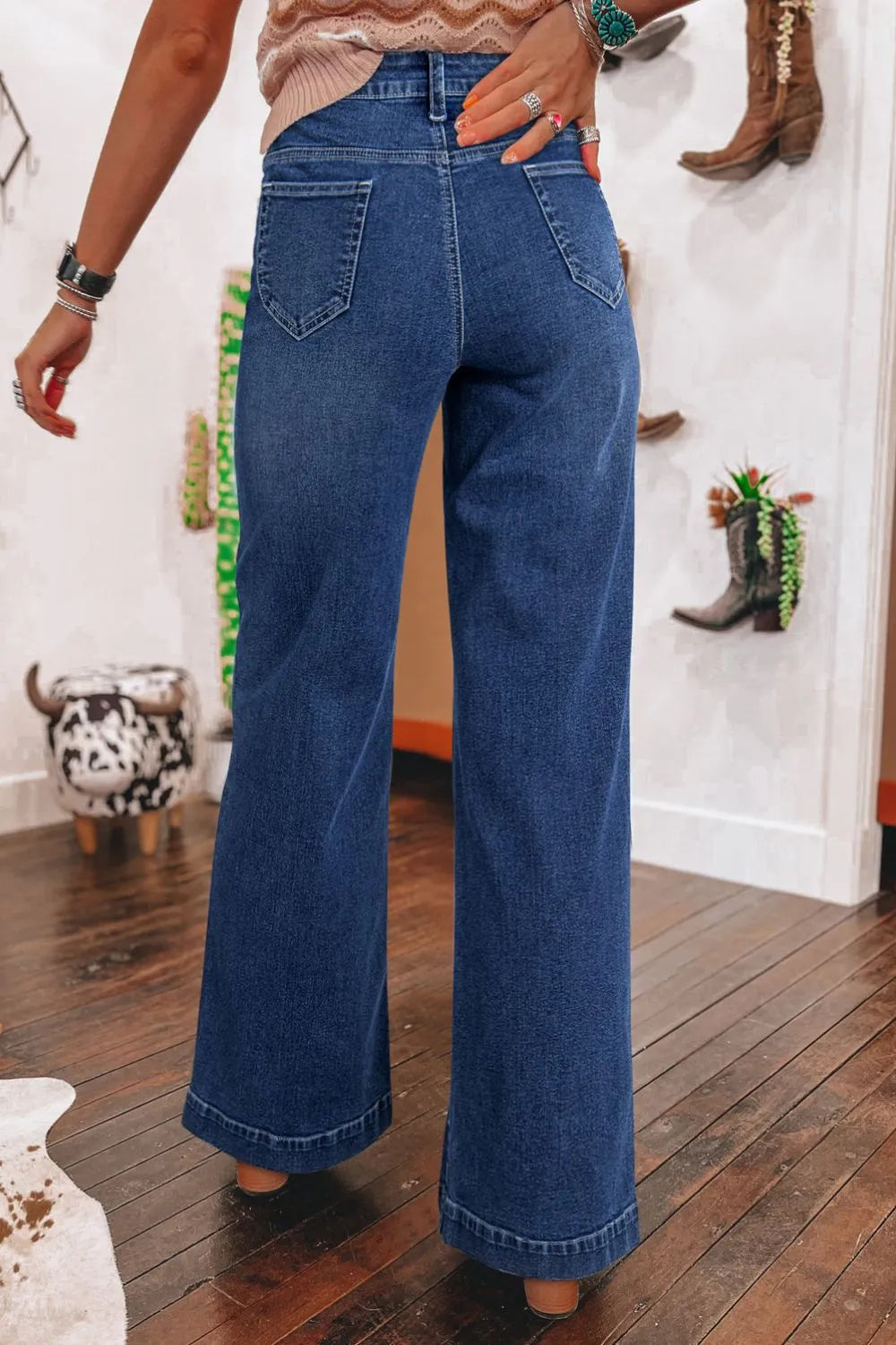 Jeans, high-waist, wide leg, front patch pockets, v-shaped back pockets, wide cuffs, vintage medium wash, button/zipper closure, belt loops, slightly stretchy, back view