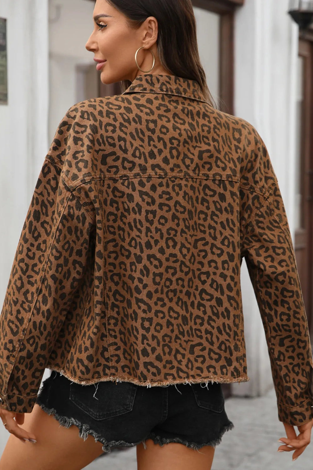 Jacket, denim, leopard print, collared, drop shoulder, buttoned, pocketed, unlined, raw hem, no stretch back view