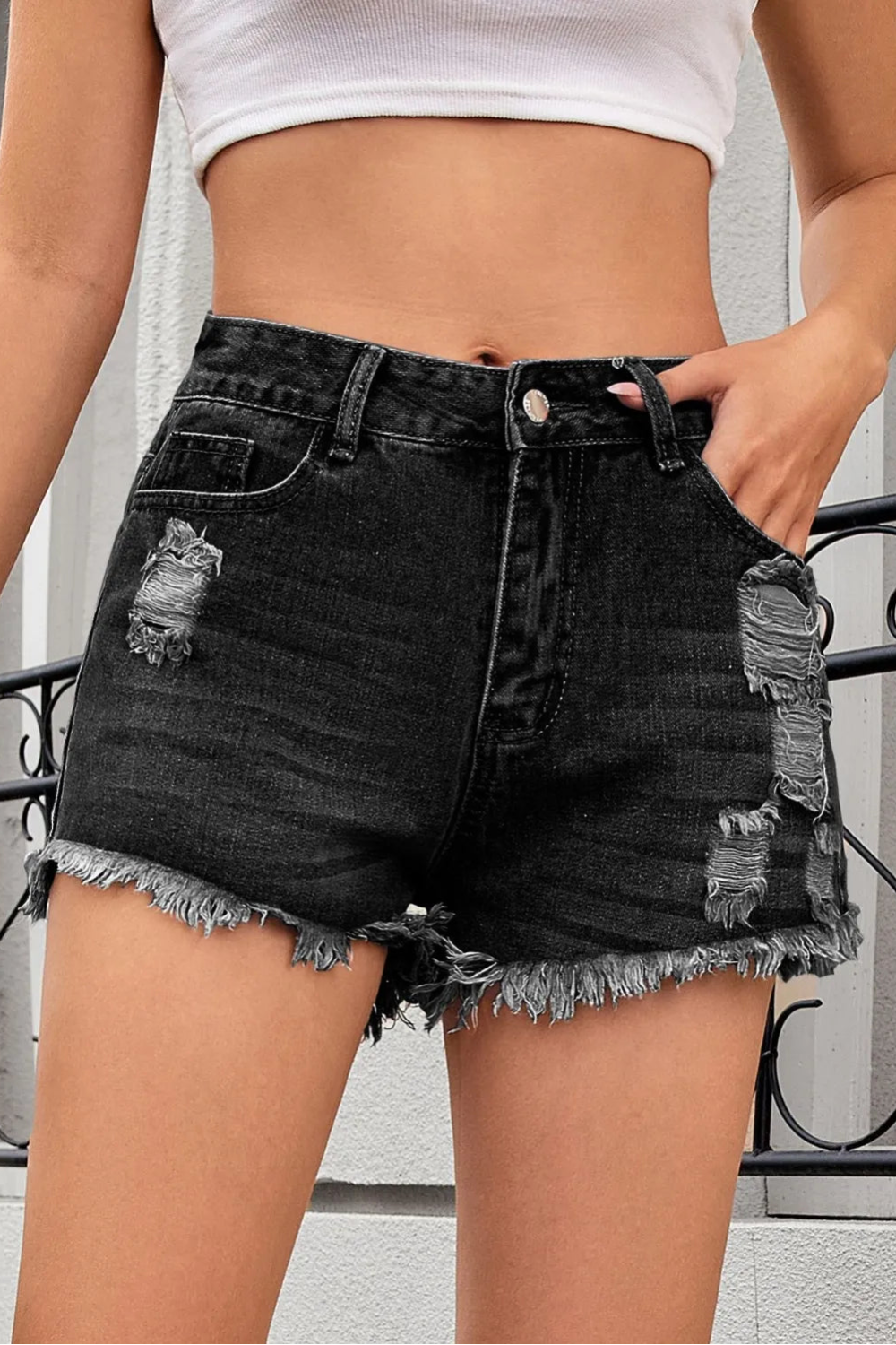 Distressed, Raw hem, High waist, Zipper and button closure, Functioning pockets,  No stretch, Denim shorts Front view