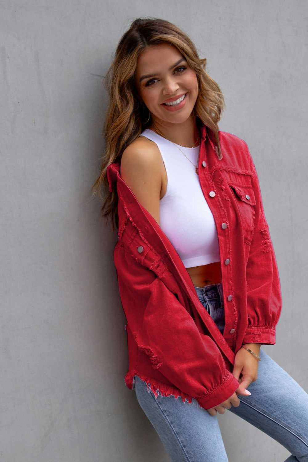 denim jacket, long sleeve, collared, buttoned, buttoned front patch pockets, distressed, fringed/raw hem, no stretch, multiple colors, front view