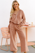 Loungewear set, two-piece, drawstring hoodie, front pockets, zippered, long sleeve, drop shoulder, drawstring bottoms, elastic waist, front pockets, exposed seams, wide leg, slightly stretchy, front view